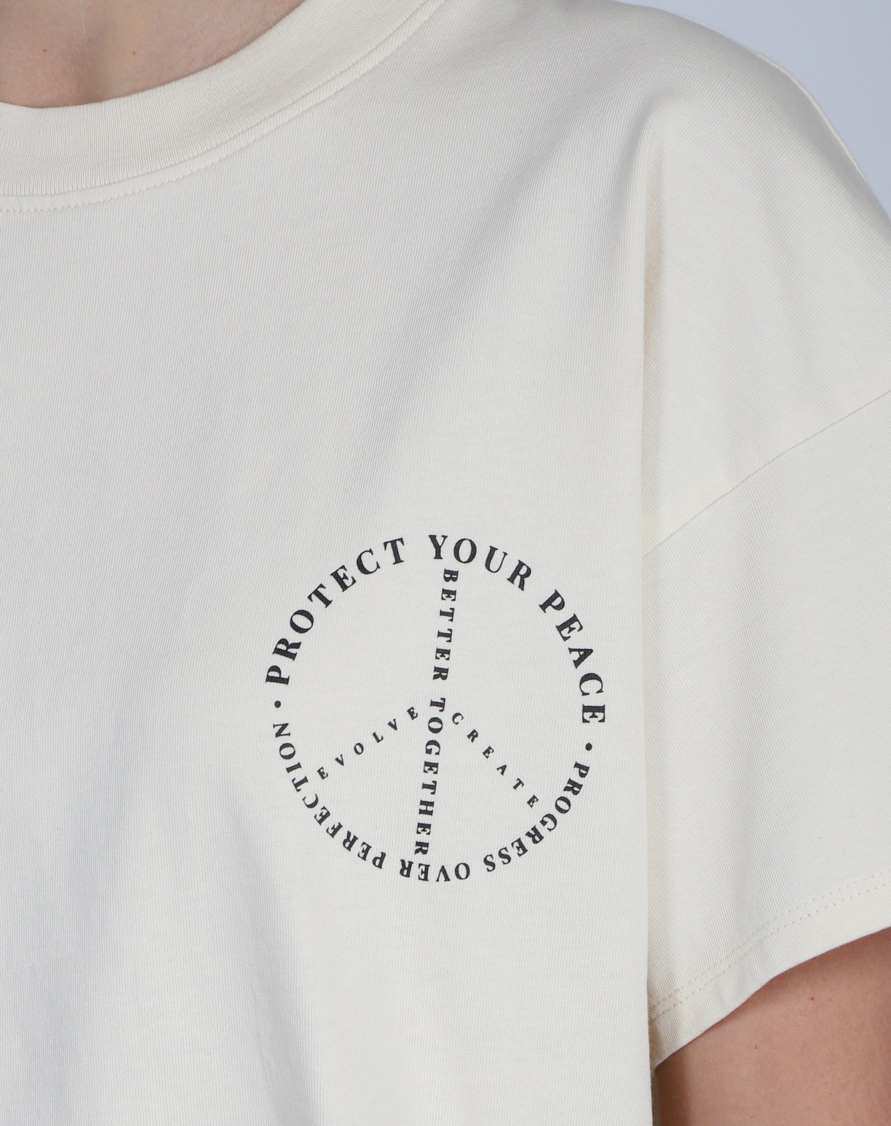 The "PROTECT YOUR PEACE" Oversized Boxy Crew Neck Tee | Almond Milk